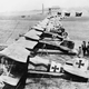 German Albatros D.IIIs of Jagdstaffel 11 and Jagdstaffel 4 parked in a line at La Brayelle near Douai, France. Richthofen’s aircraft is the second aircraft in line, painted red. (Imperial War Museum)